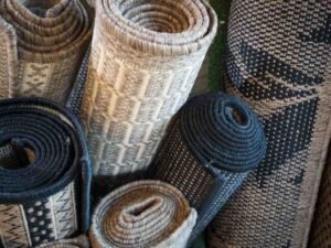 a group of rolled up rugs